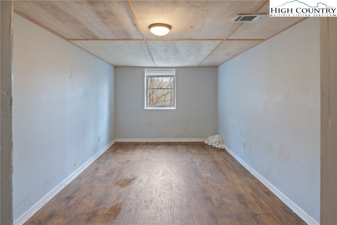 656 Winterberry Trail Boone, NC 28607 - Photo 31 of 47 an empty room with a empty space and windows