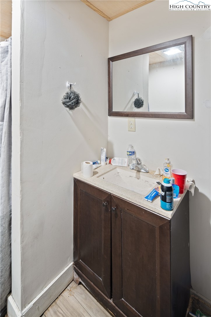 656 Winterberry Trail Boone, NC 28607 - Photo 33 of 47 a bathroom with a sink vanity and a mirror