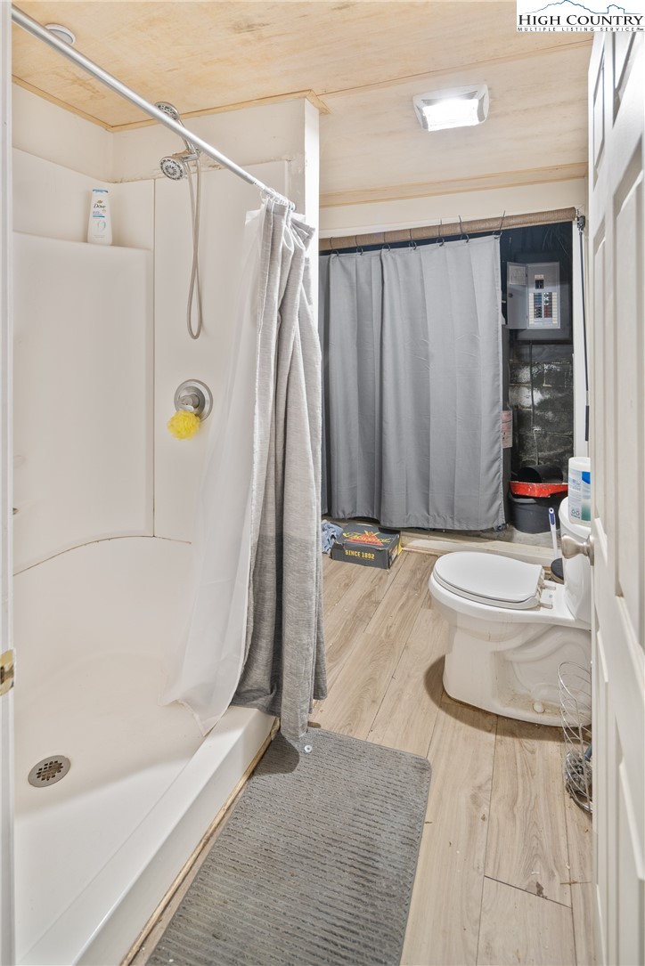 656 Winterberry Trail Boone, NC 28607 - Photo 34 of 47 a bathroom with a tub and a shower
