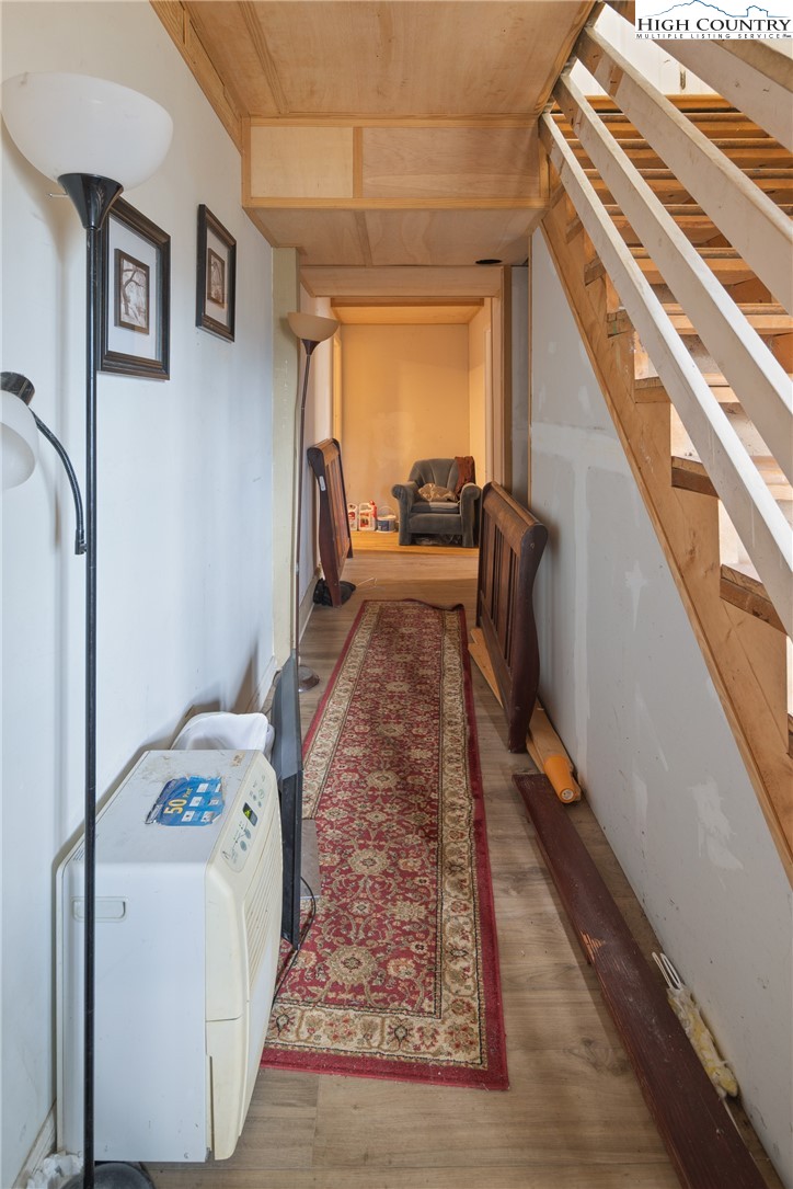 656 Winterberry Trail Boone, NC 28607 - Photo 36 of 47 a living room with furniture and a rug