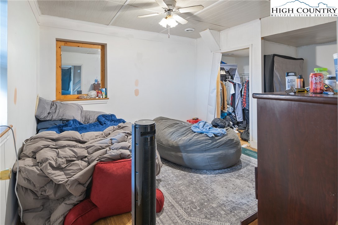 656 Winterberry Trail Boone, NC 28607 - Photo 37 of 47 a living room with furniture and a chandelier