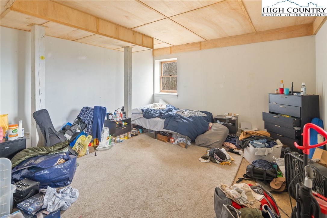 656 Winterberry Trail Boone, NC 28607 - Photo 39 of 47 a room with furniture a gym equipment and a window