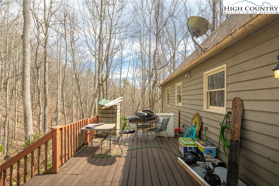 656 Winterberry Trail Boone, NC 28607 - Photo 4 of 47 a view of balcony with chairs and wooden fence