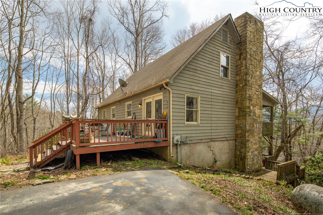656 Winterberry Trail Boone, NC 28607 - Photo 4 of 47 a view of a house with a yard