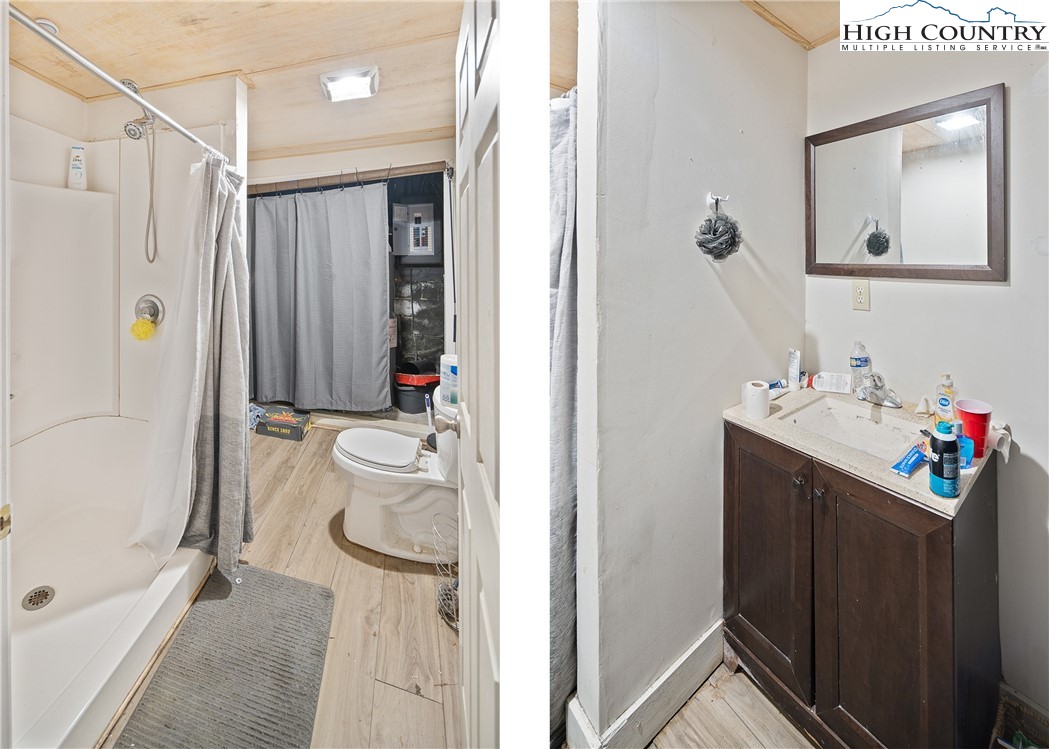 656 Winterberry Trail Boone, NC 28607 - Photo 43 of 47 a bathroom with a sink vanity mirror and tub