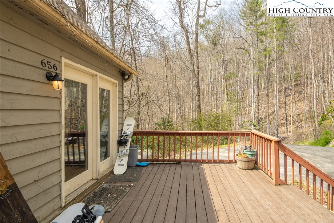 656 Winterberry Trail Boone, NC 28607 - Photo 7 of 47 a view of a balcony with wooden floor