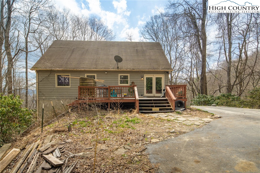 656 Winterberry Trail Boone, NC 28607 - Photo 9 of 47 front view of a house with a yard