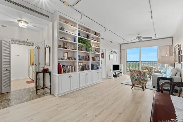 a room with lots of furniture and white walls