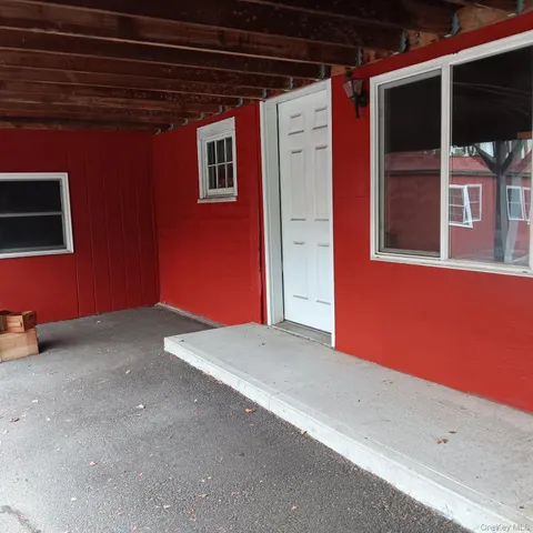a view of an empty room with a projector