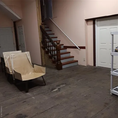 a living room with stairs and stairs