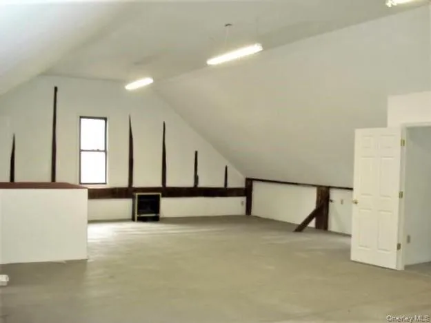 a view of an empty room with windows