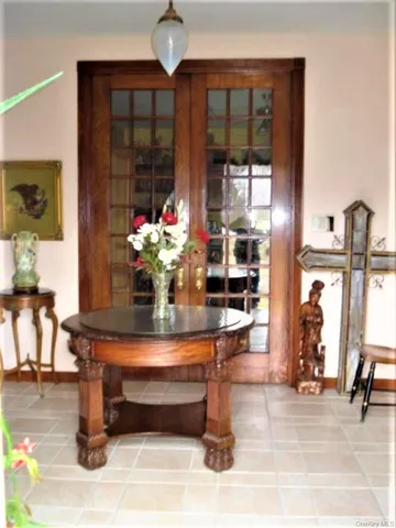 a dining room with furniture and wooden floor