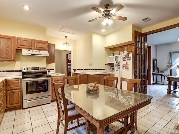 a kitchen with a dining table and chairs