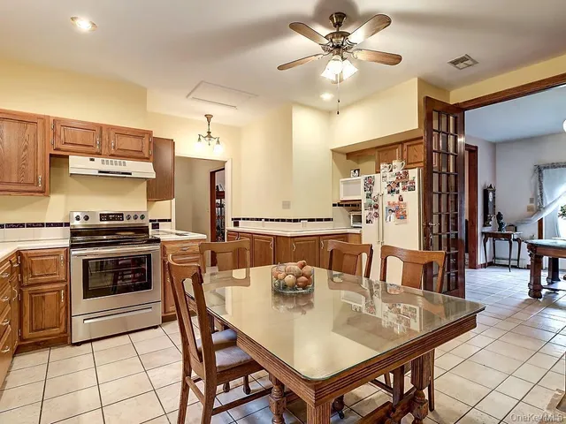 a kitchen with a dining table and chairs