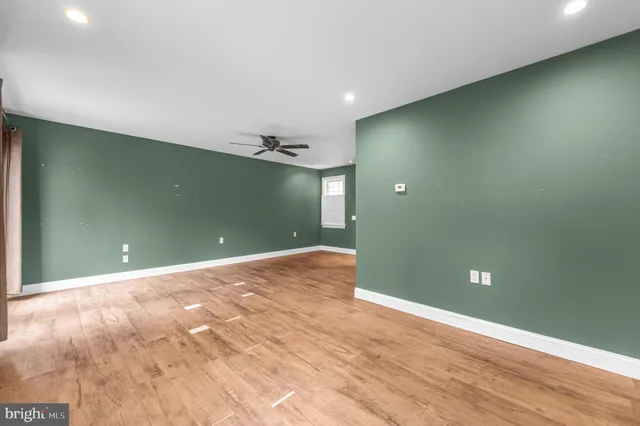 a view of a livingroom with wooden floor