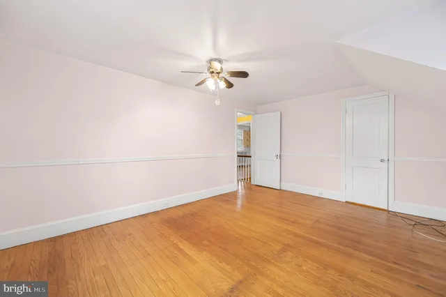 a bathroom with a bathtub and window