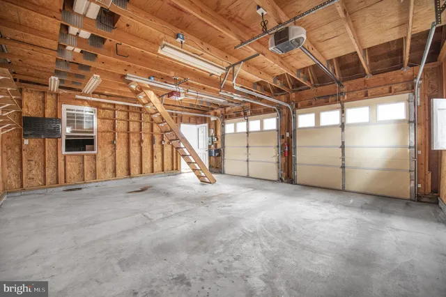 a front view of a house with wooden fence