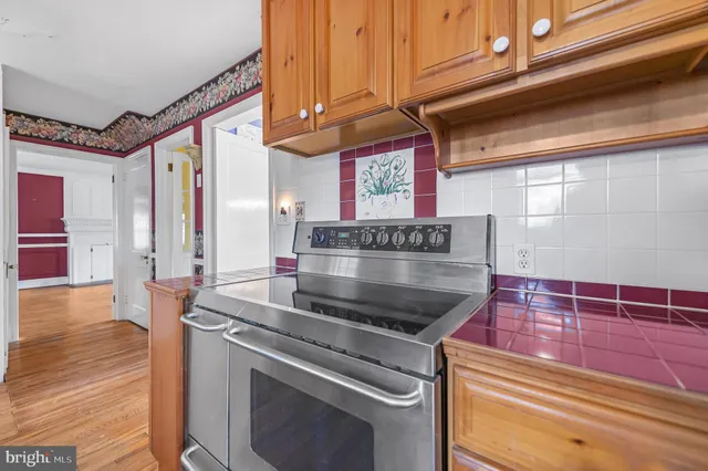 a kitchen with stainless steel appliances granite countertop a stove and a sink