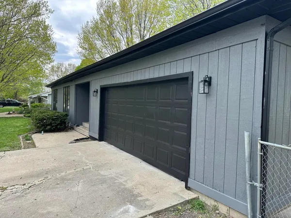 a backyard of a house with garage