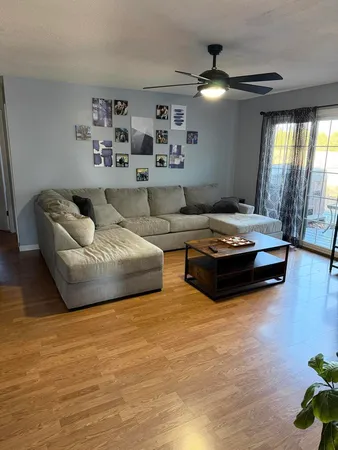 a living room with furniture and a large window