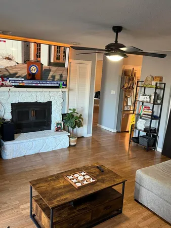 a living room with furniture and a fireplace