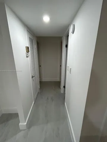 an entryway of a house with a hallway