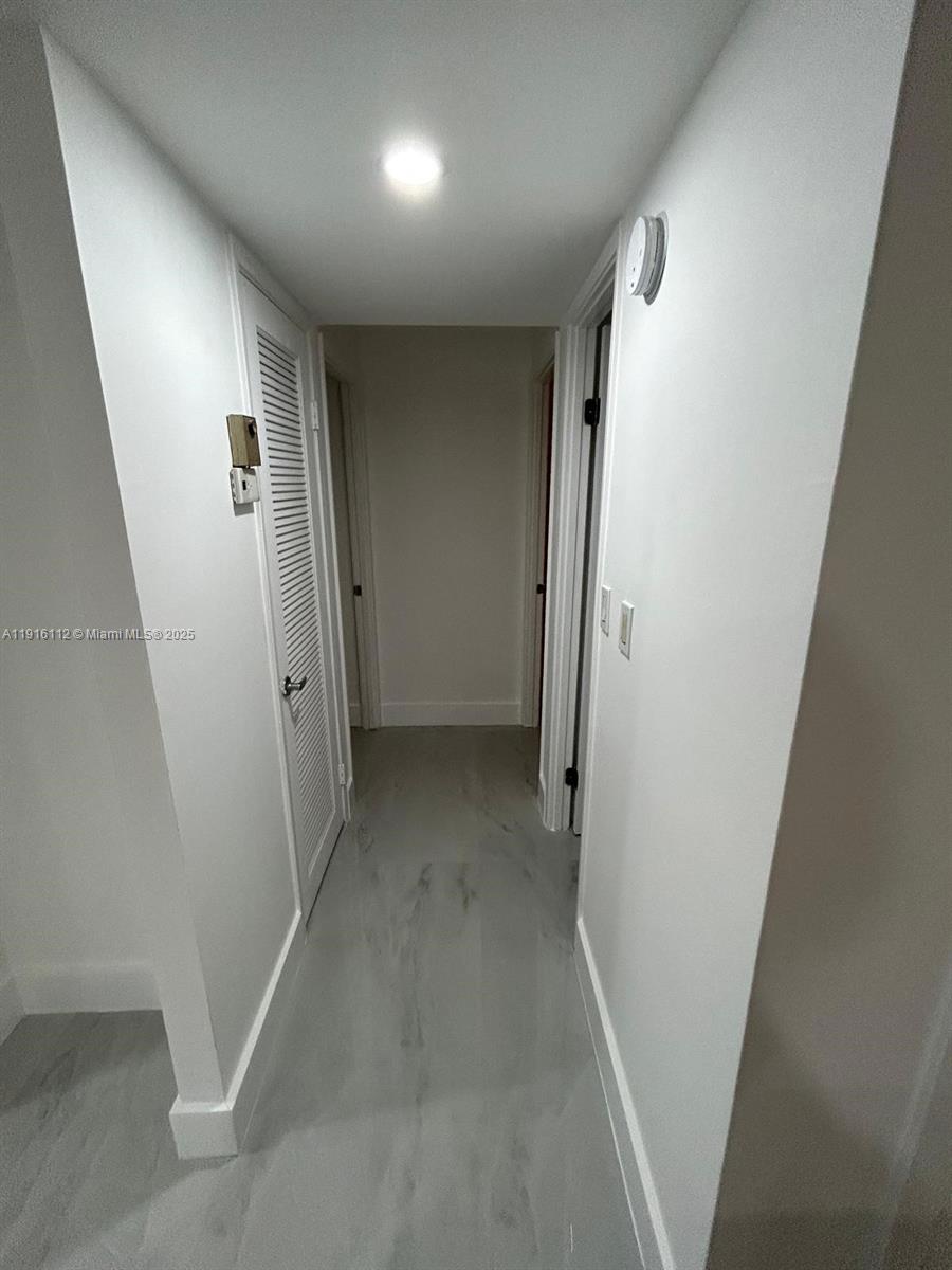 1750 Northeast 191st Street, Unit 4264 Miami, FL 33179 - Photo 12 of 21 an entryway of a house with a hallway