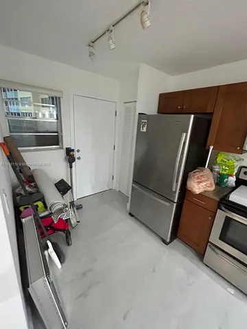 a room with furniture and white walls