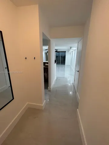 a view of hallway with livingroom