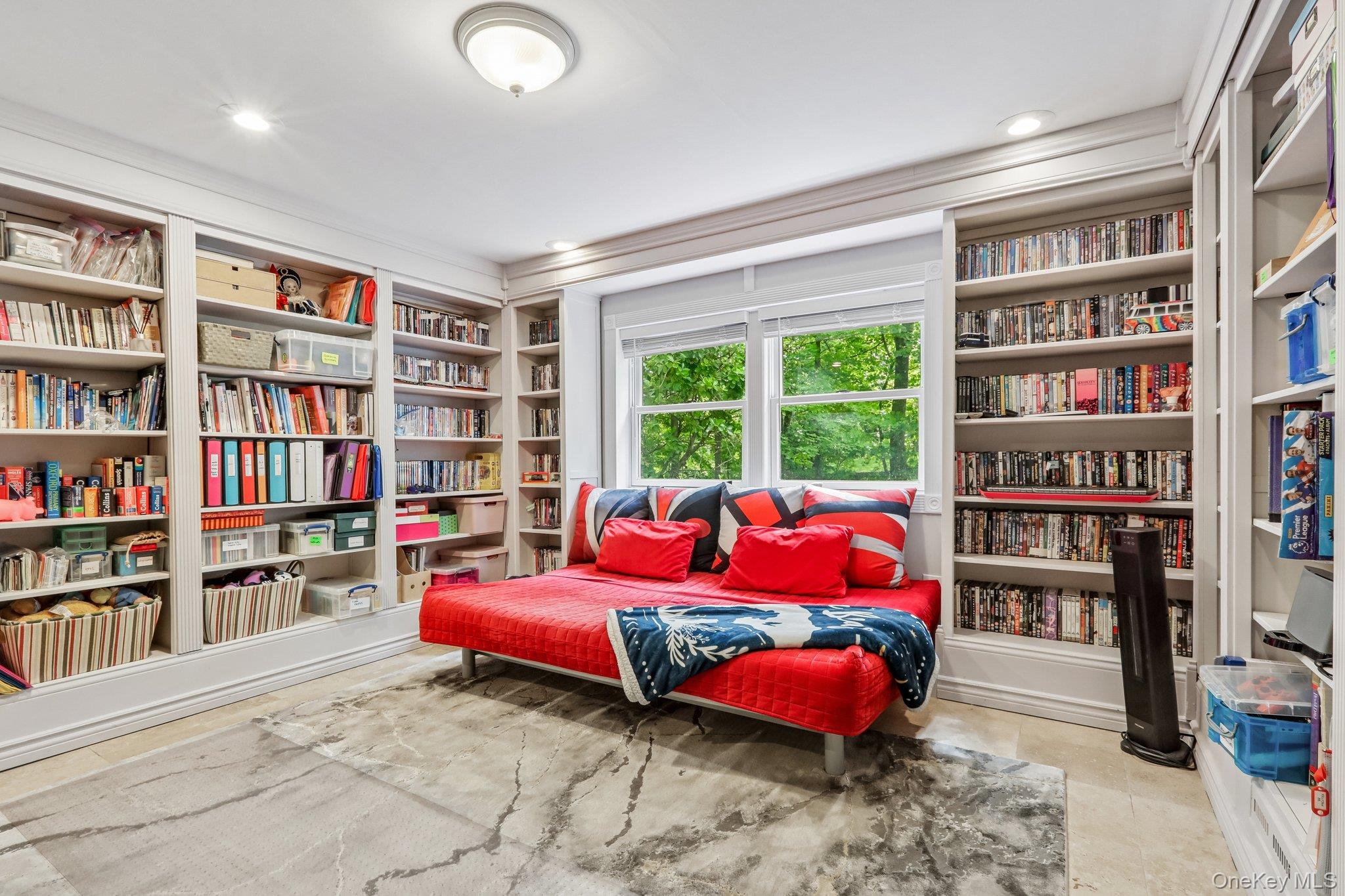 62 Mohegan Road Larchmont, NY 10538 - Photo 38 of 46 a bedroom with a bed and book shelf