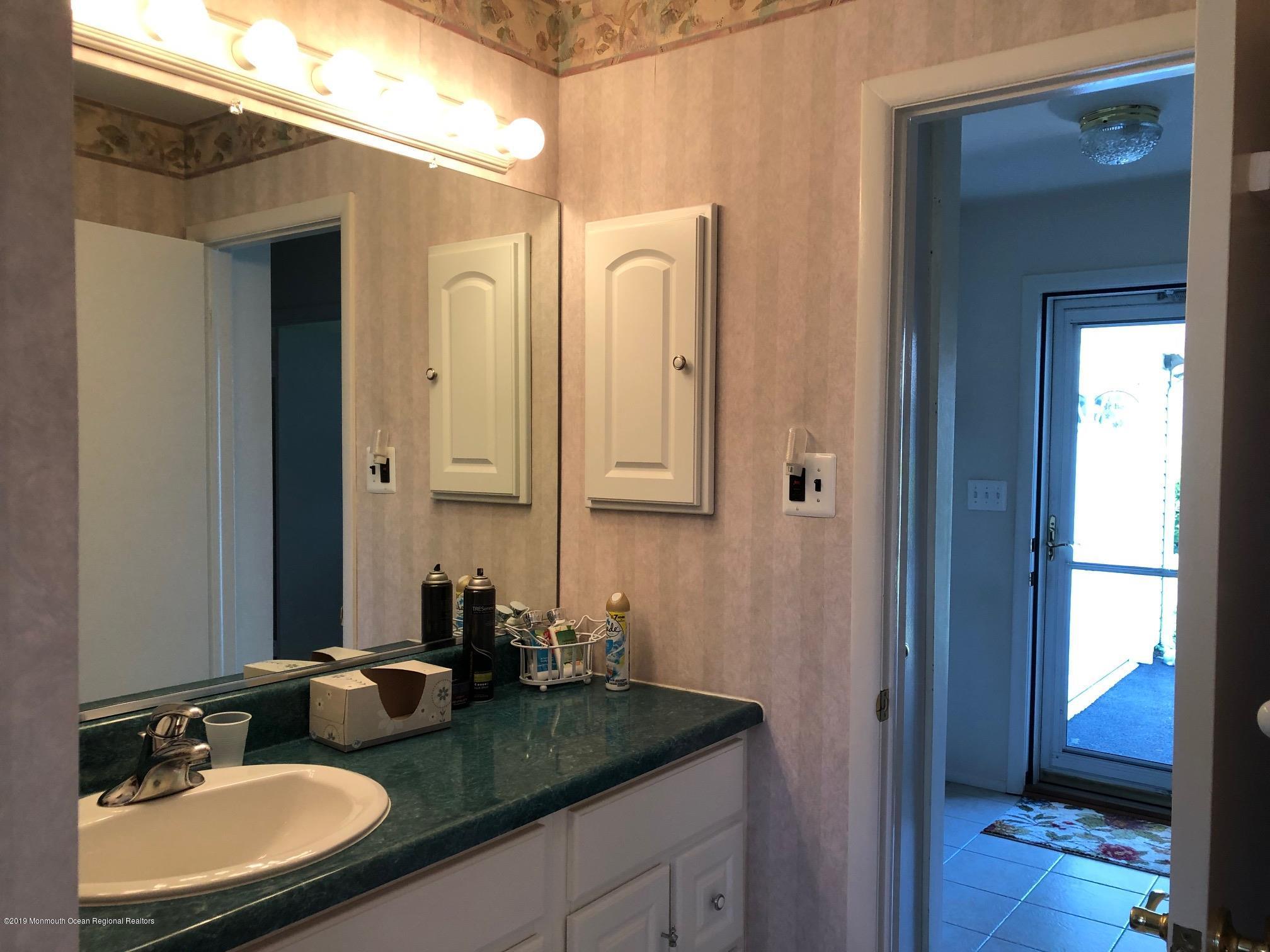 15 Robinson Road Brick, NJ 08724 - Photo 13 of 24 a bathroom with a granite countertop sink and a mirror