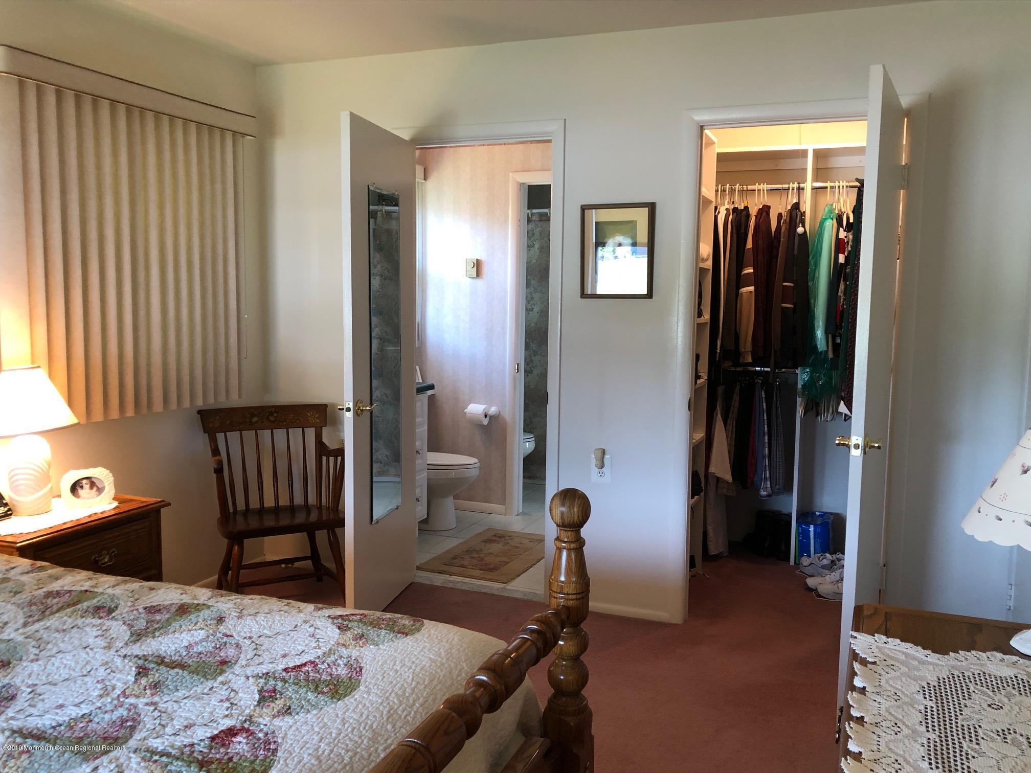 15 Robinson Road Brick, NJ 08724 - Photo 16 of 24 a bedroom with a bed and wooden floor