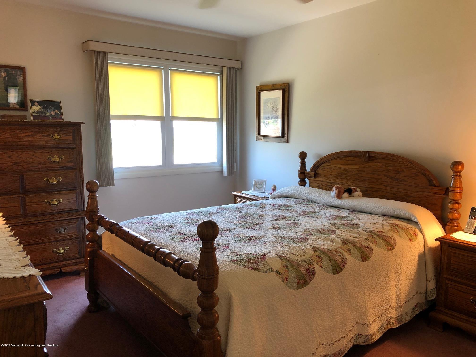 15 Robinson Road Brick, NJ 08724 - Photo 17 of 24 a bedroom with a bed and a window