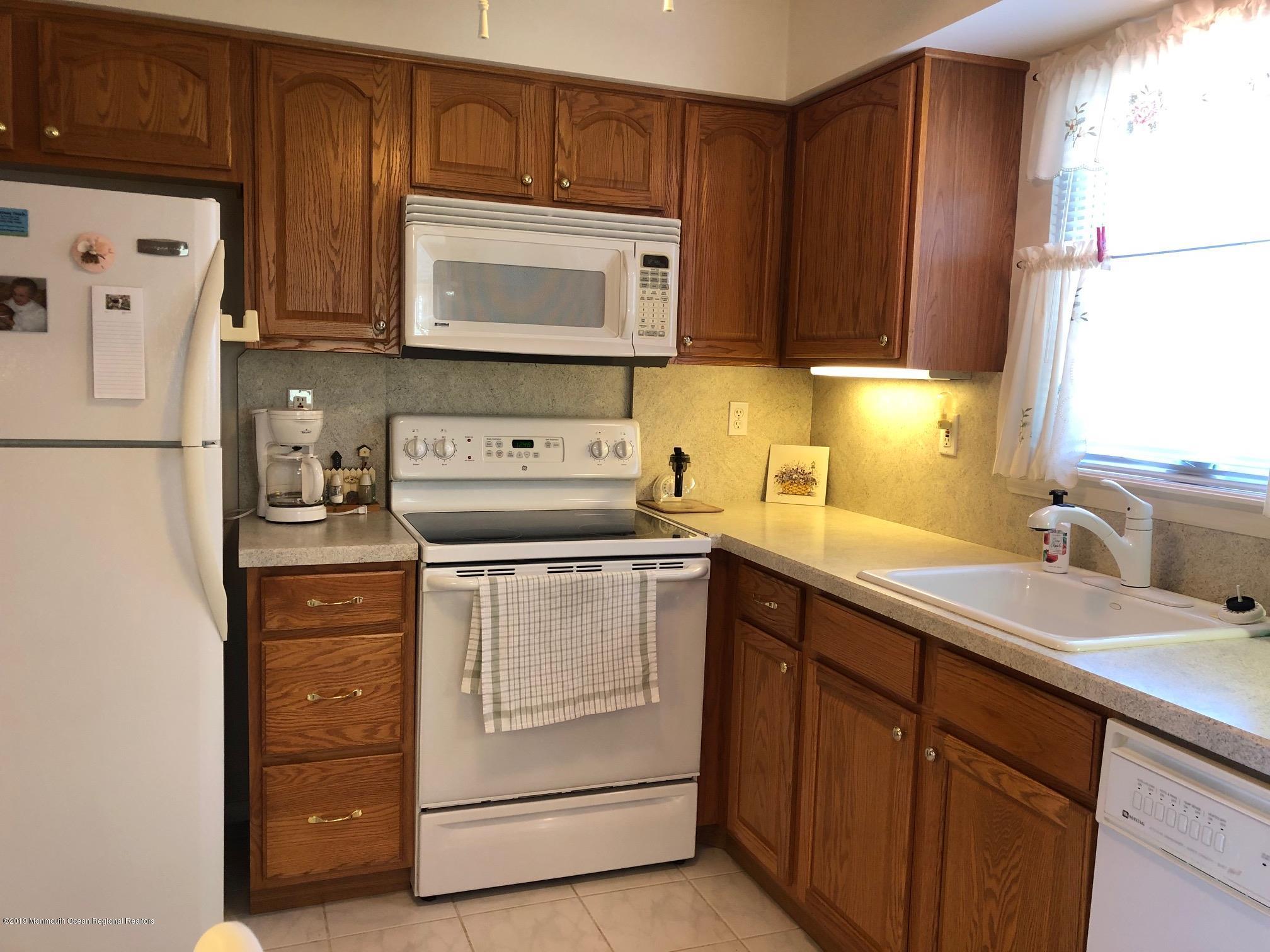 15 Robinson Road Brick, NJ 08724 - Photo 2 of 24 a kitchen with stainless steel appliances granite countertop white refrigerator stove a sink and dishwasher