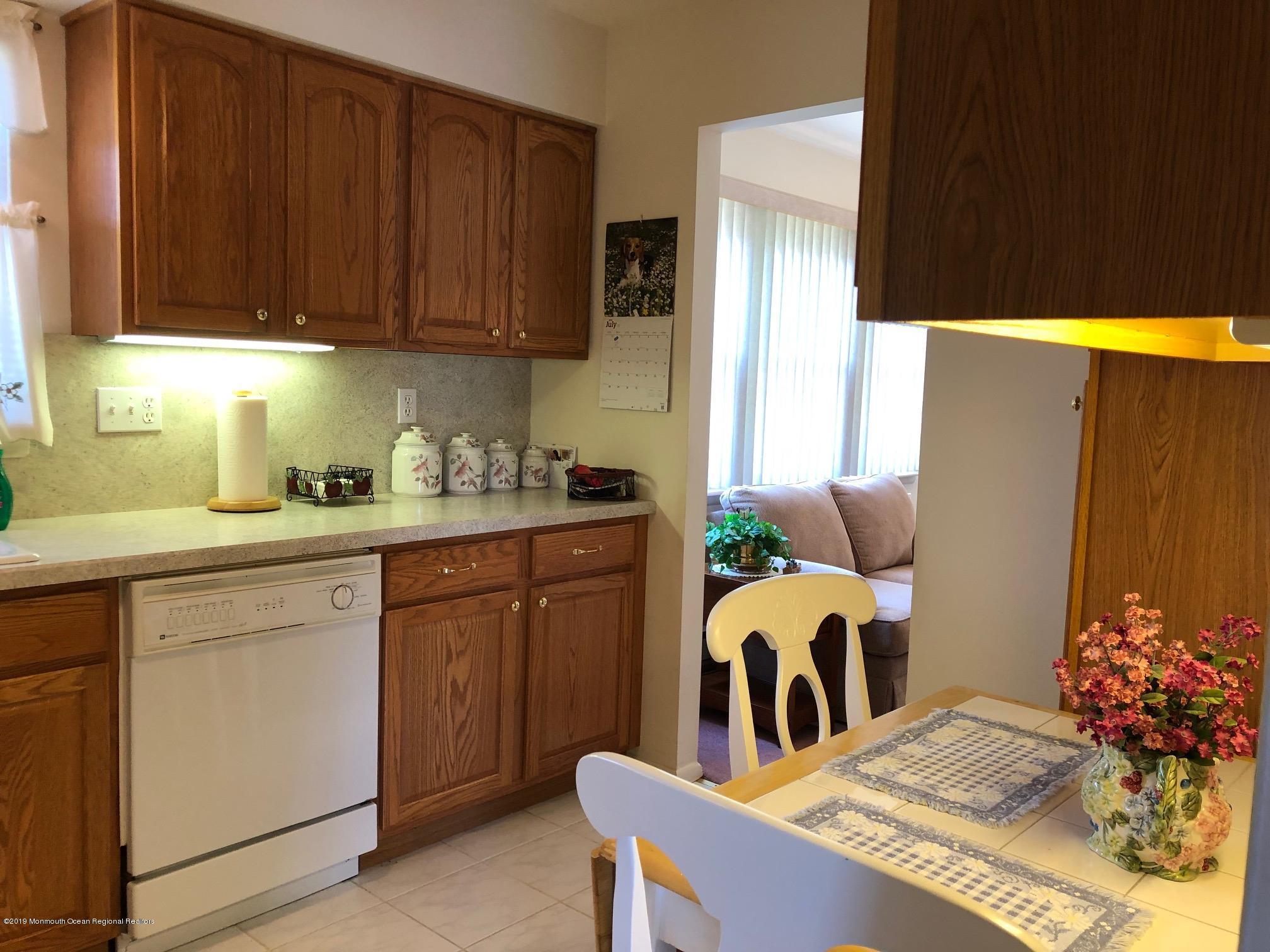 15 Robinson Road Brick, NJ 08724 - Photo 6 of 24 a kitchen with furniture a refrigerator and cabinets