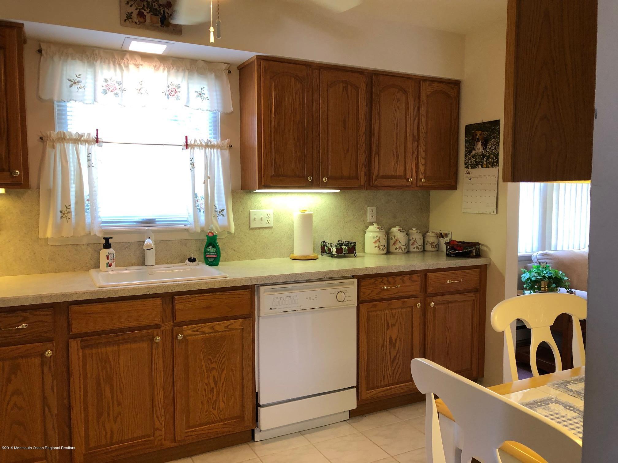 15 Robinson Road Brick, NJ 08724 - Photo 8 of 24 a kitchen with sink cabinets and window