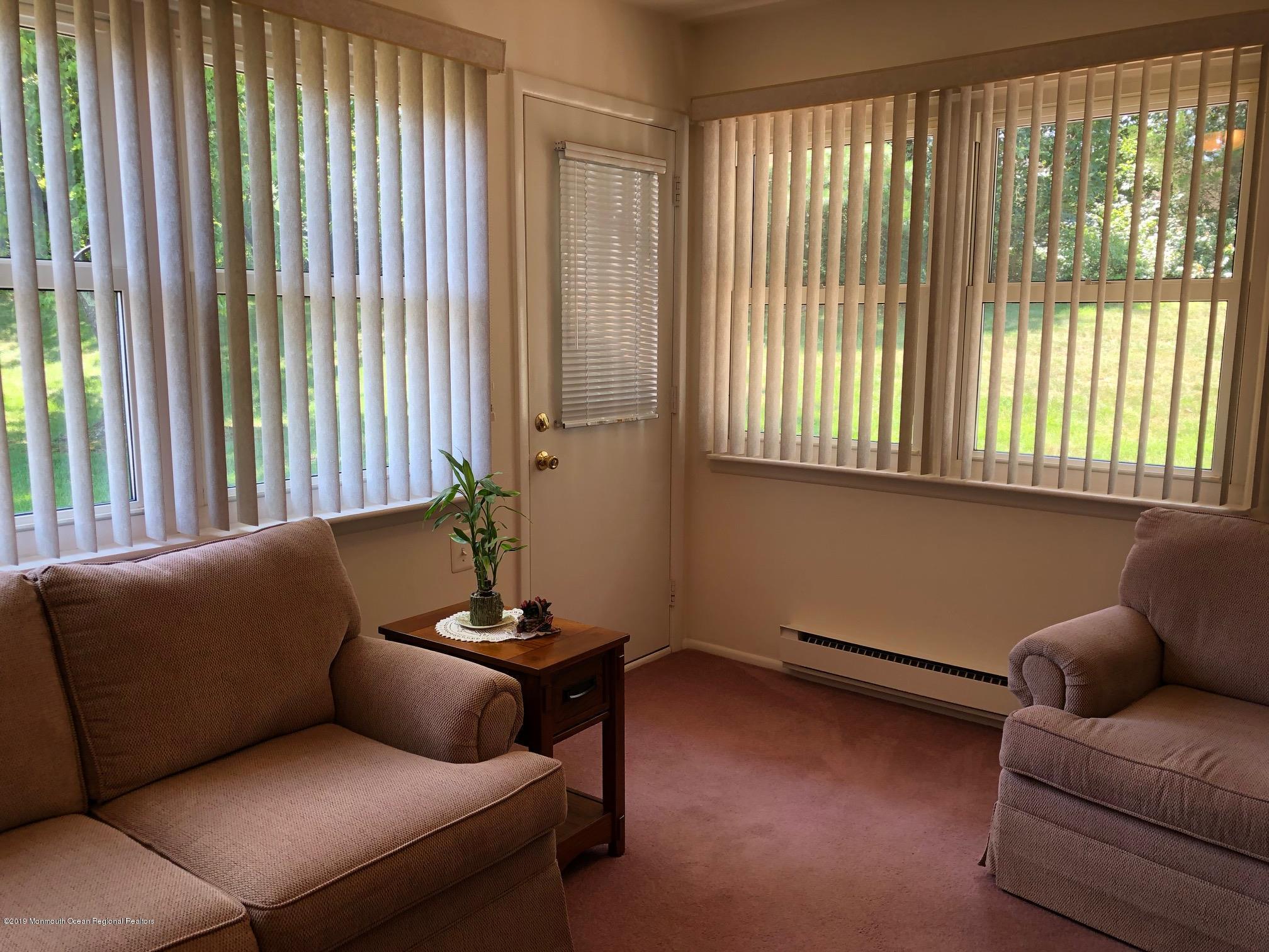 15 Robinson Road Brick, NJ 08724 - Photo 10 of 24 a living room with furniture and a window