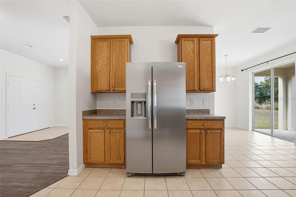 7702 Dragon Fly Loop Gibsonton, FL 33534 - Photo 14 of 42 a kitchen with stainless steel appliances granite countertop a refrigerator and a stove
