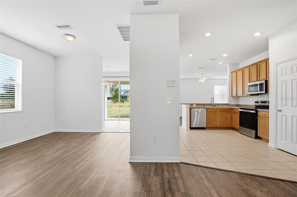 7702 Dragon Fly Loop Gibsonton, FL 33534 - Photo 17 of 42 a view of kitchen with wooden floor