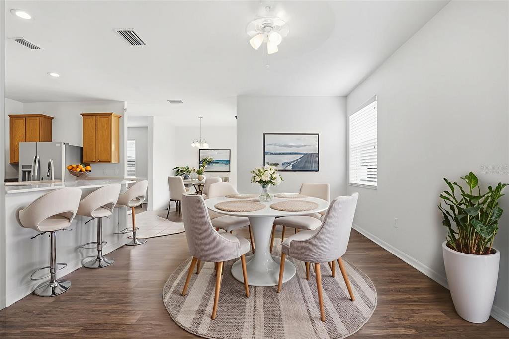 7702 Dragon Fly Loop Gibsonton, FL 33534 - Photo 18 of 42 a view of a dining room with furniture window and wooden floor