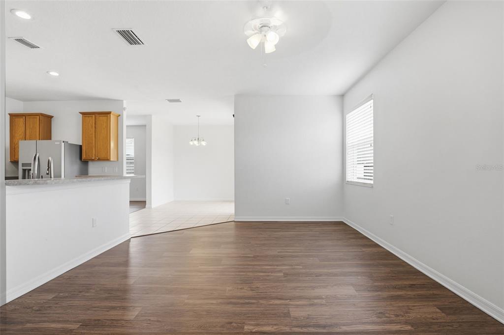 7702 Dragon Fly Loop Gibsonton, FL 33534 - Photo 19 of 42 a view of a livingroom with wooden floor and a window