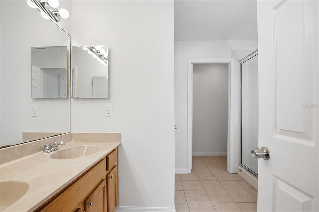 7702 Dragon Fly Loop Gibsonton, FL 33534 - Photo 36 of 42 a bathroom with a sink and a mirror