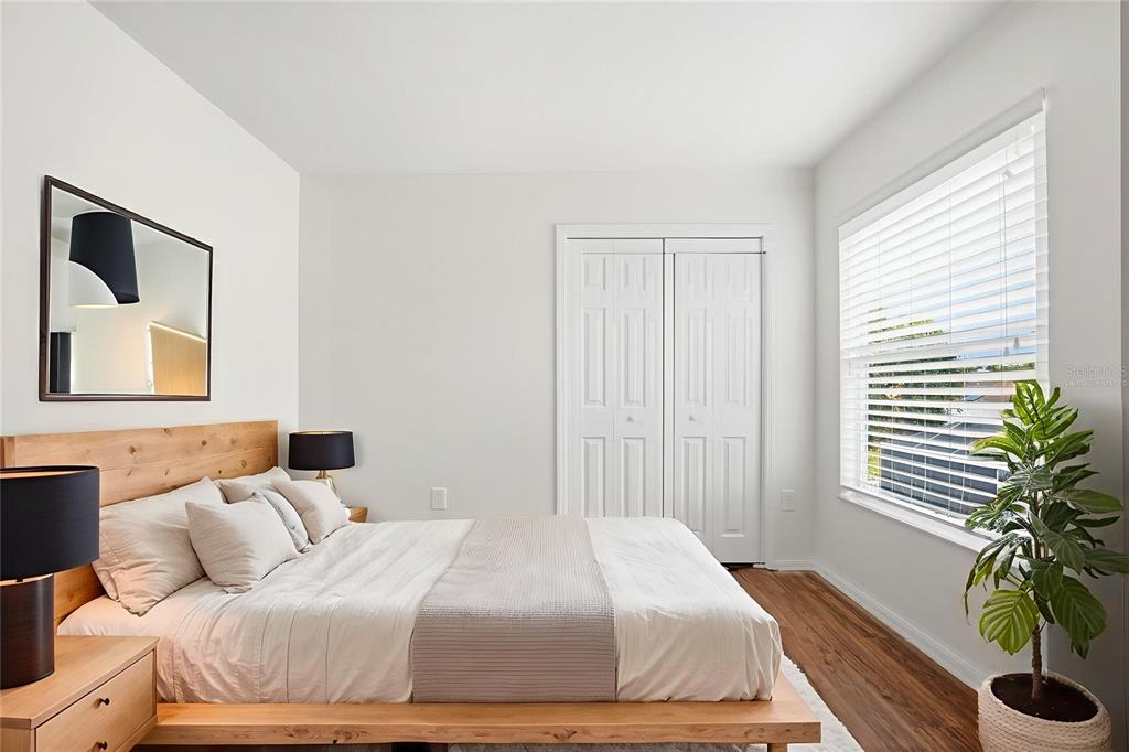 7702 Dragon Fly Loop Gibsonton, FL 33534 - Photo 8 of 42 a bedroom with a bed and a window