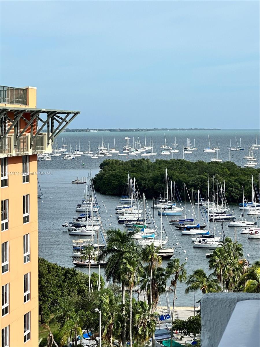 a view of multiple houses with ocean view