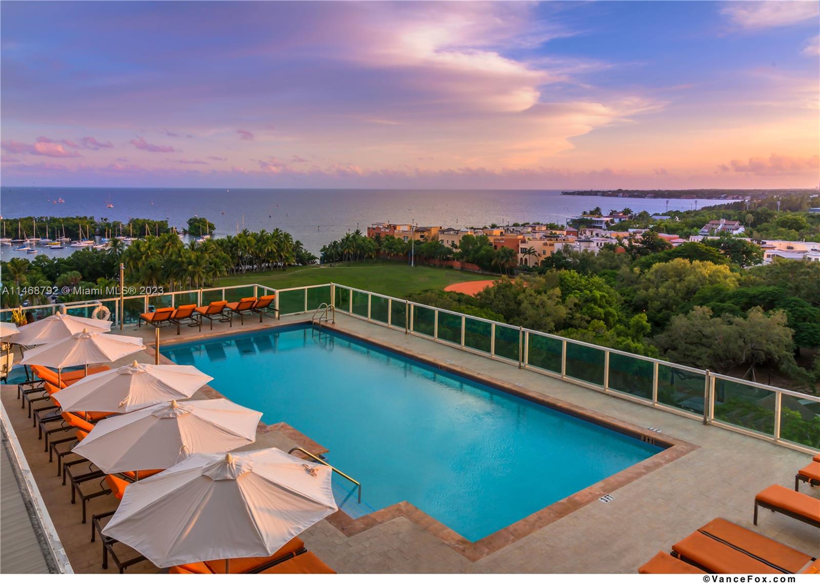 2889 McFarlane Road, Unit 903 Miami, FL 33133 - Photo 10 of 10 a view of a swimming pool with a lounge chair