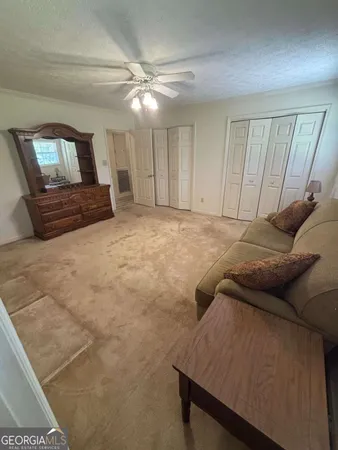 a bedroom with a bed and cabinets