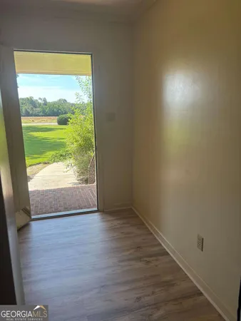 a view of an empty room and window
