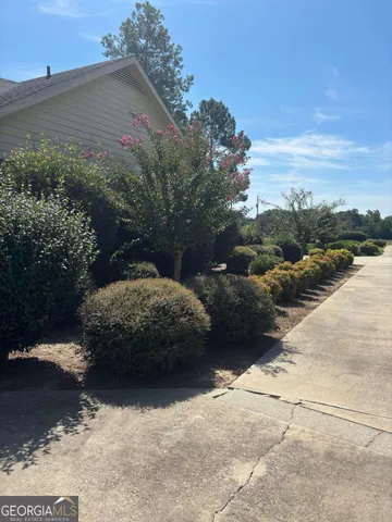 a spacious bedroom with a bed and window