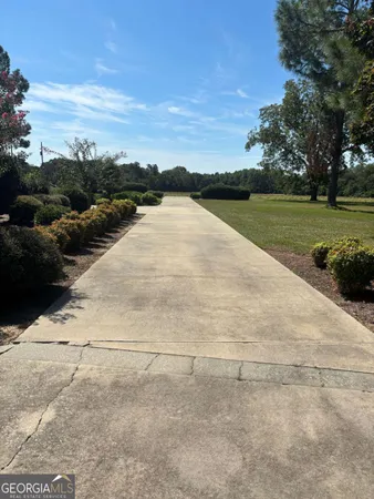 a view of hallway with wooden floor