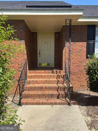 a view of a garden with an outdoor space